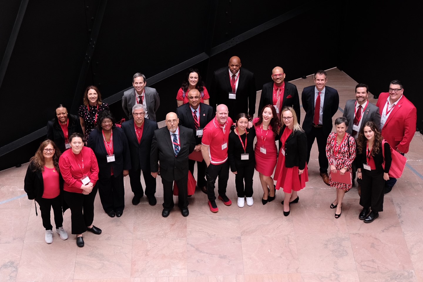 Advocates all dressed up pose down on the floor below the camera