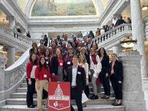 A large group of volunteers in the Utah State Capitol.