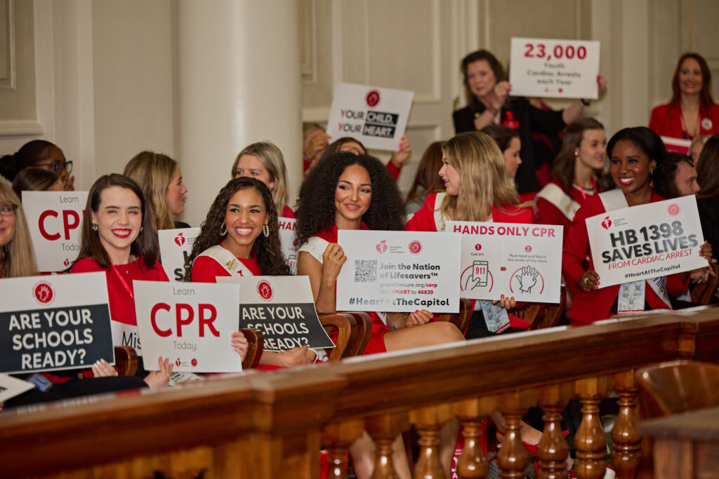 Advocates with signs at press conference