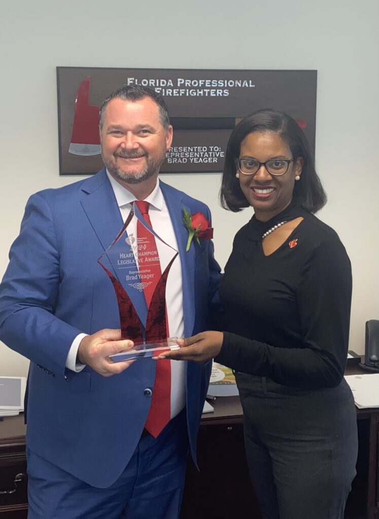 Tiffany McCaskill Henderson, AHA Florida Government Relations Director (right), presenting award to Rep. Yeager.