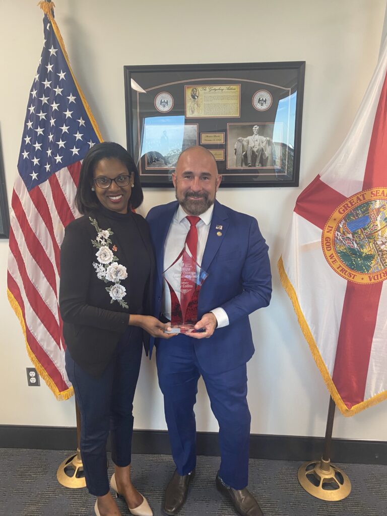 Tiffany McCaskill Henderson, AHA Florida Government Relations Director (left), presenting award to Sen. Collins
