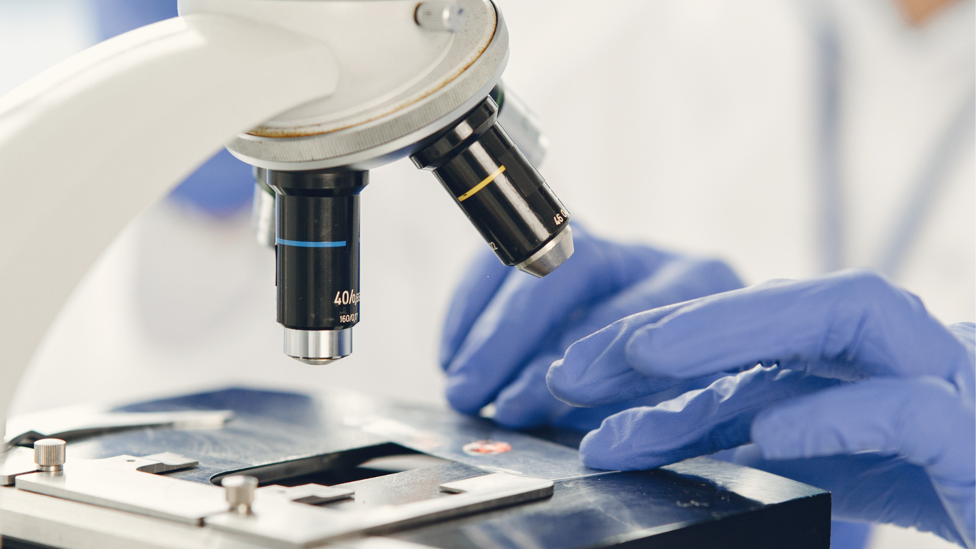 Person using a microscope.