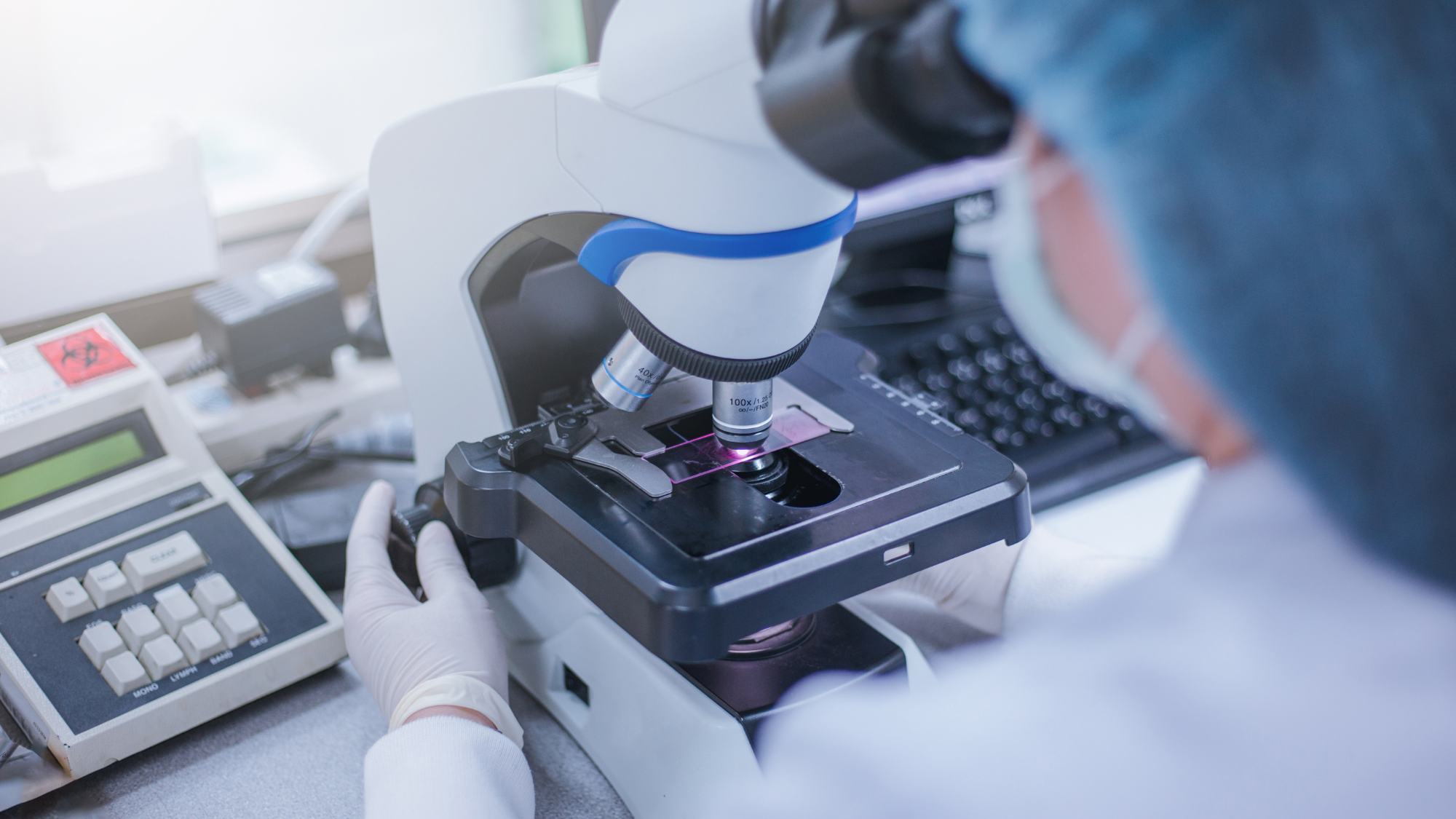 A researcher using equipment in a laboratory.